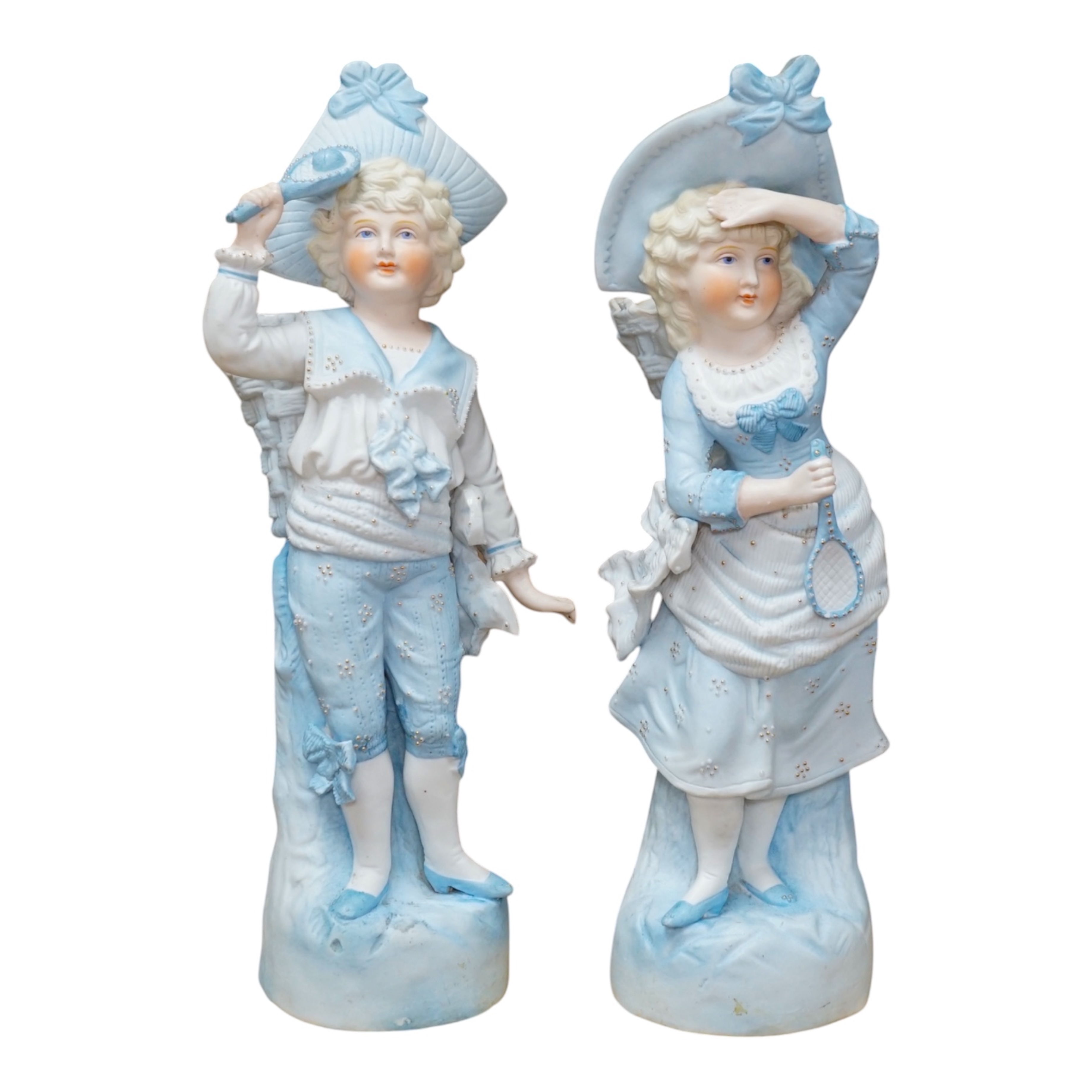 A pair of late 19th century German figurative bisque spill vases, 30cm high. Condition - good